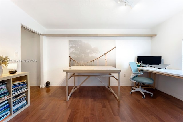 home office with track lighting, baseboards, and wood finished floors