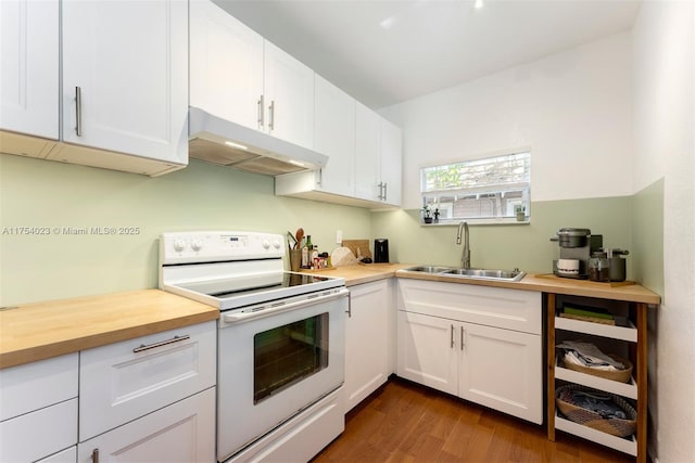 kitchen with electric range, white cabinetry, a sink, butcher block countertops, and under cabinet range hood