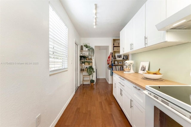 kitchen with white cabinets, wood finished floors, range hood, open shelves, and track lighting