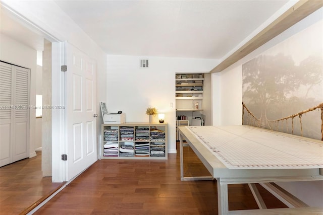 interior space featuring visible vents and wood finished floors