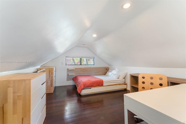 bedroom with lofted ceiling, dark wood finished floors, and recessed lighting