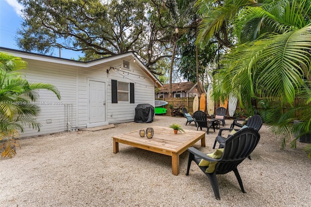 view of patio / terrace featuring fence