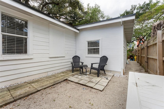 view of patio / terrace featuring fence