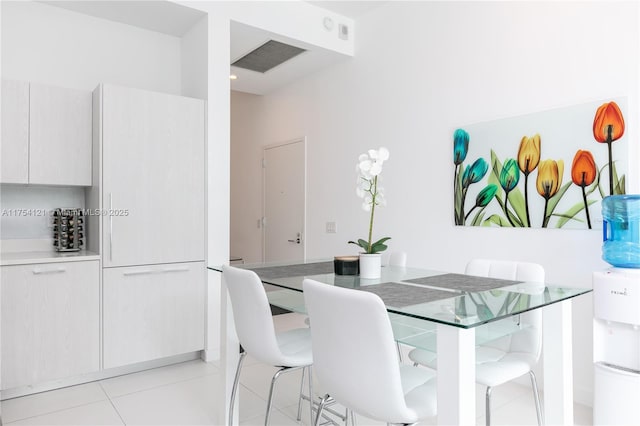 dining space featuring visible vents and light tile patterned floors