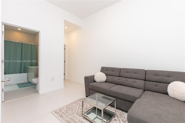 tiled living area with baseboards