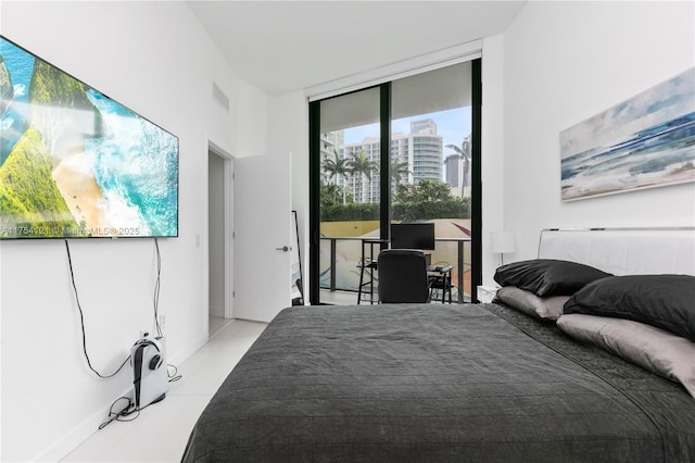 bedroom featuring expansive windows, access to outside, visible vents, and light tile patterned floors