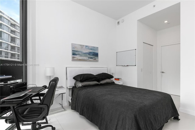 bedroom with light tile patterned flooring