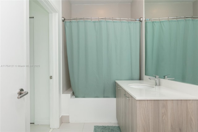 bathroom with shower / bathtub combination with curtain, vanity, and tile patterned floors