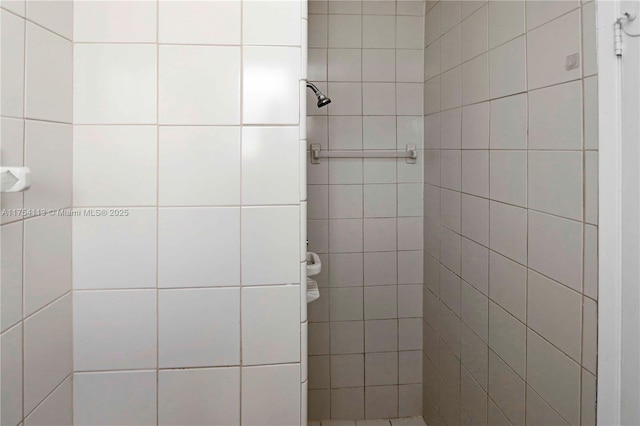 full bath featuring tiled shower