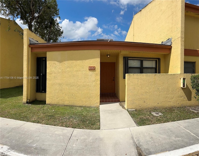 view of front of home with stucco siding