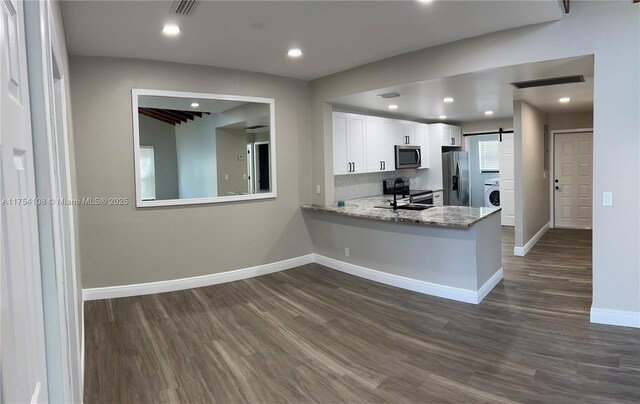 1640 NW 93rd Ave Unit 306, Pembroke Pines, FL 33024 - unfurnished bedroom featuring multiple closets, baseboards, dark wood-style flooring, and ceiling fan