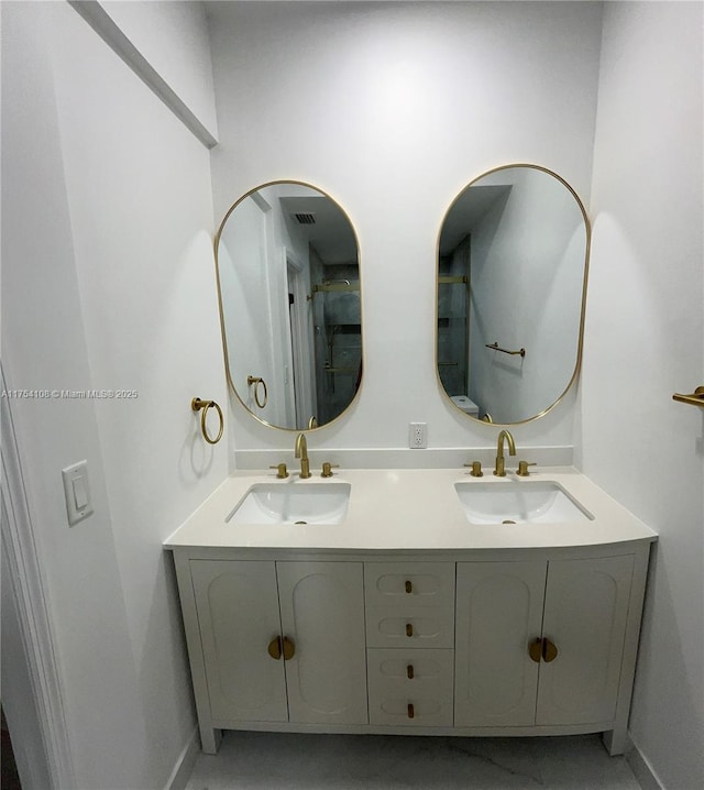 1640 NW 93rd Ave Unit 306, Pembroke Pines, FL 33024 - bathroom with toilet, baseboards, a sink, and marble finish floor