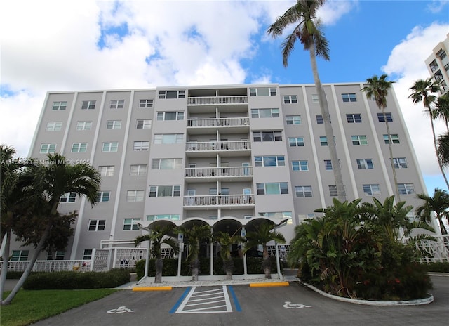 view of property featuring uncovered parking