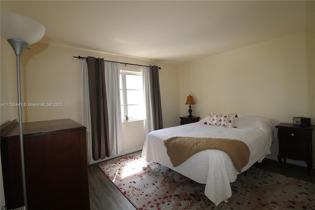 bedroom featuring wood finished floors