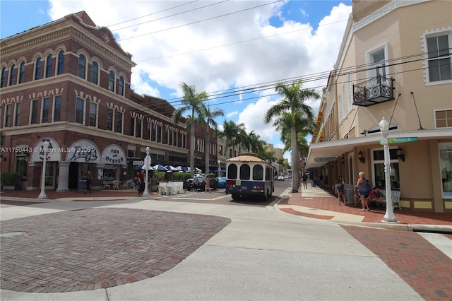 view of street with sidewalks, street lighting, and curbs