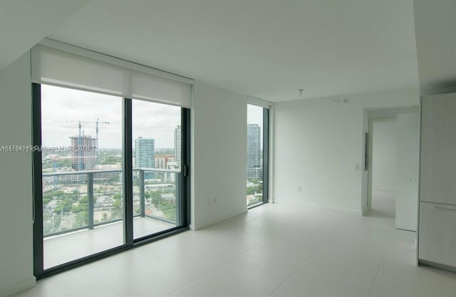 empty room with a view of city and expansive windows