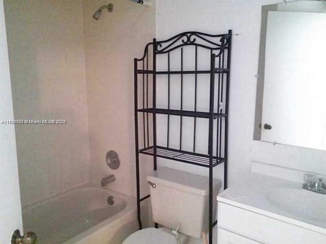 bathroom with toilet, shower / washtub combination, and vanity