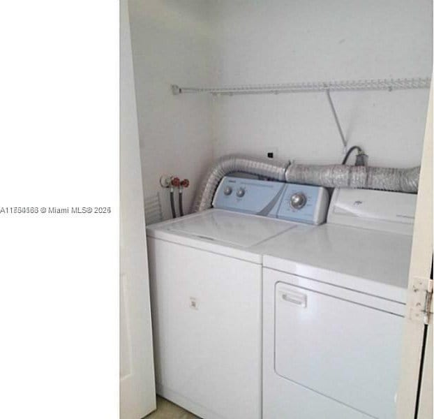 laundry area with laundry area and independent washer and dryer