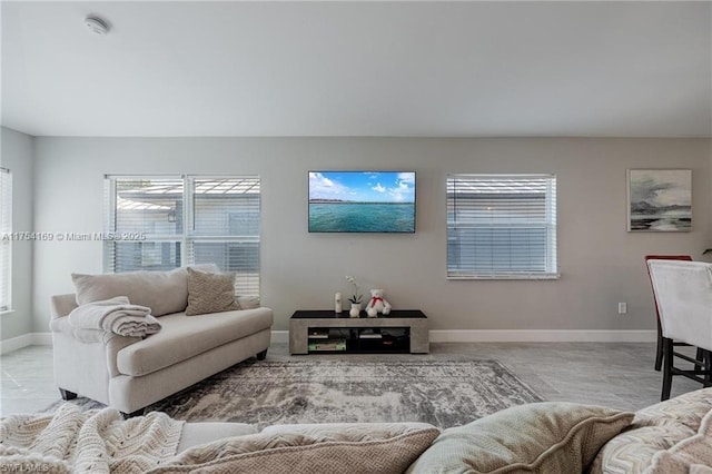 living room featuring baseboards