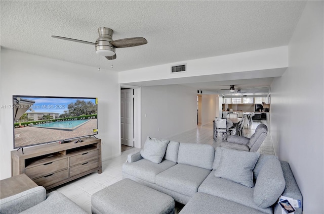 1524 Whitehall Dr Unit 102, Davie, FL 33324 - living area with a ceiling fan and a textured ceiling