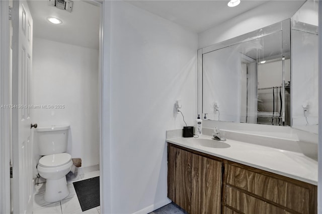 bathroom featuring visible vents, vanity, and toilet