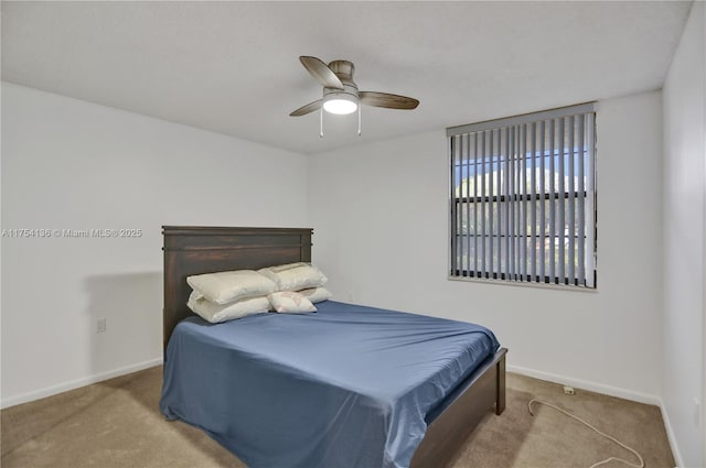 bedroom with carpet floors, ceiling fan, and baseboards