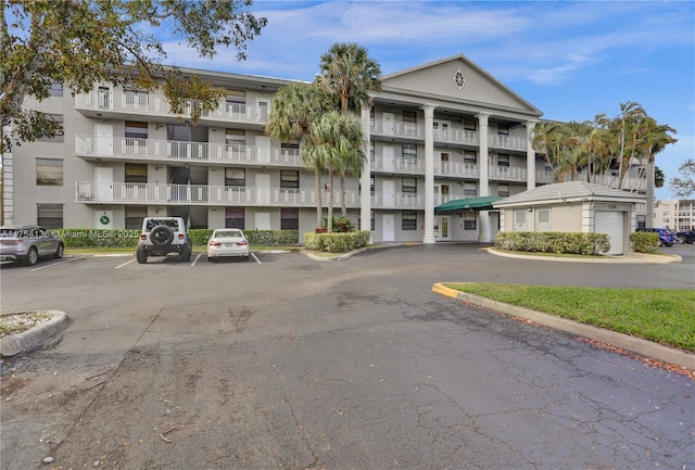 view of building exterior featuring uncovered parking