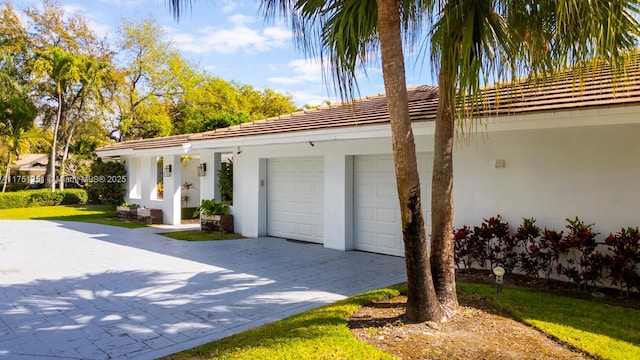 exterior space with decorative driveway