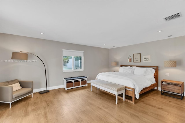 bedroom with recessed lighting, baseboards, visible vents, and light wood finished floors