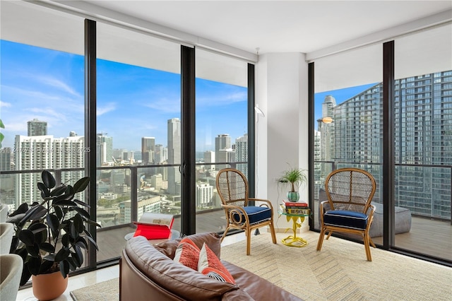 sunroom / solarium featuring a city view