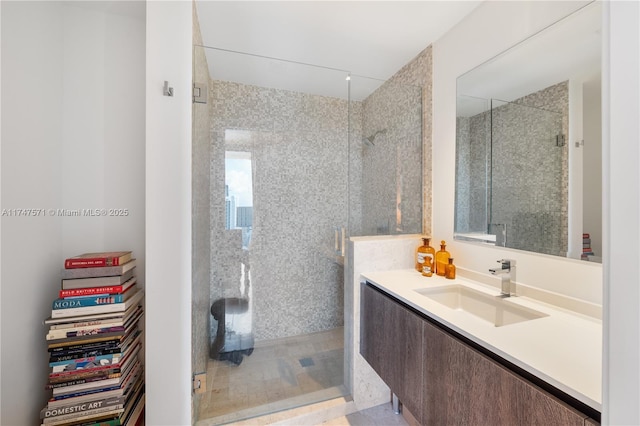 bathroom featuring a stall shower and vanity