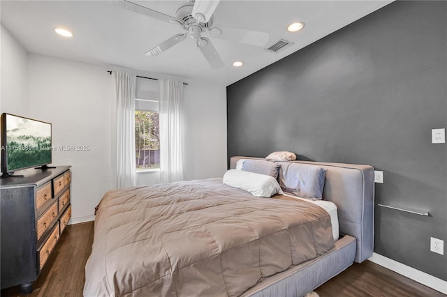 bedroom with visible vents, dark wood finished floors, recessed lighting, baseboards, and ceiling fan