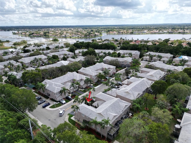 birds eye view of property with a residential view and a water view