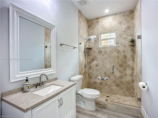 7684 County Rd 78, La Belle, FL 33935 - full bath with toilet, a stall shower, vanity, and visible vents