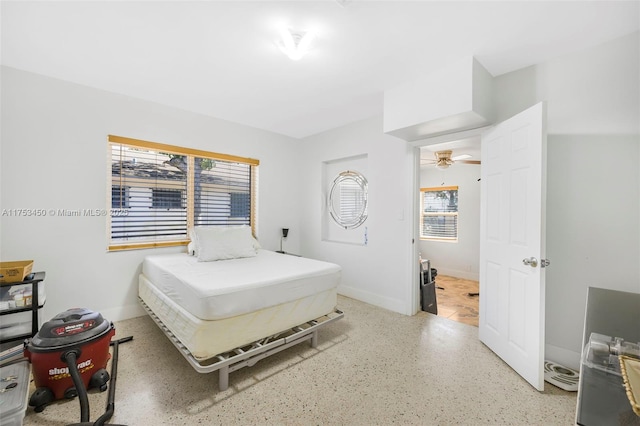 bedroom featuring baseboards