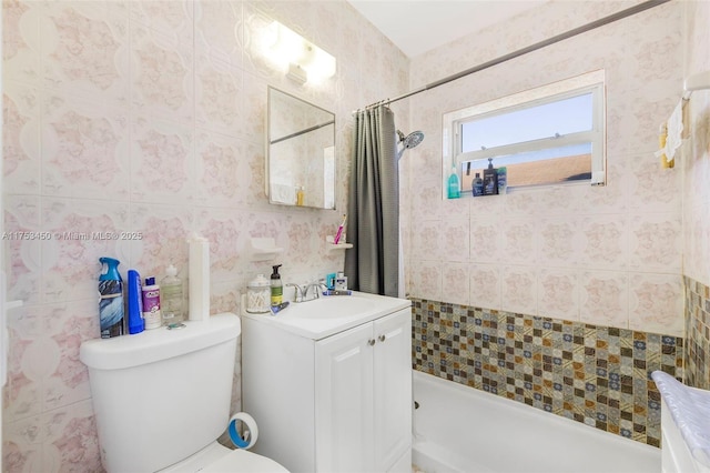 full bath with toilet, tile walls, tiled shower, and vanity