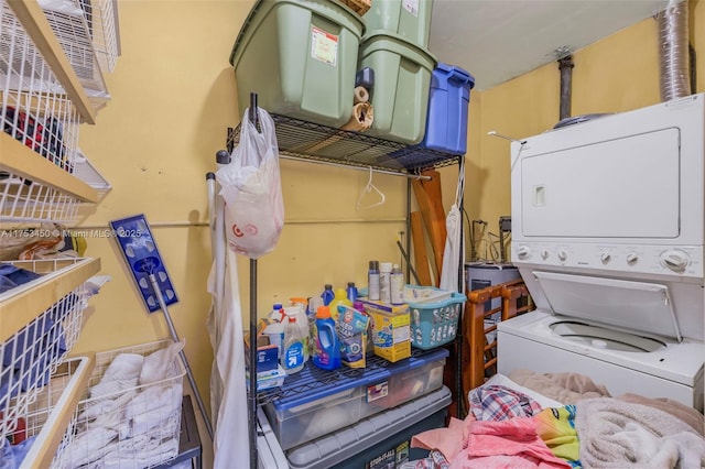 interior space with stacked washer and dryer