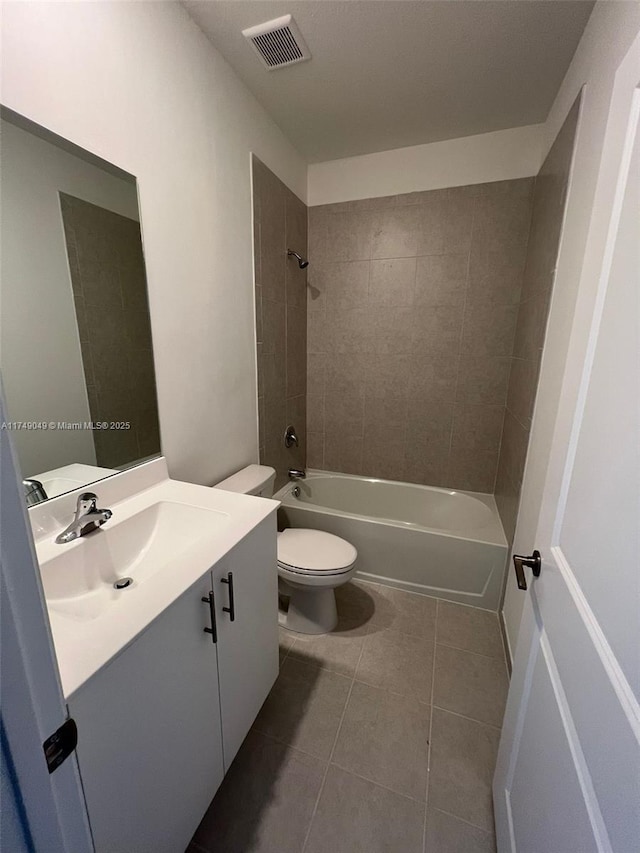 bathroom with visible vents, toilet, tile patterned floors, tub / shower combination, and vanity