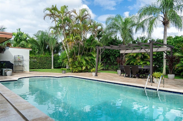 outdoor pool with a pergola and a patio