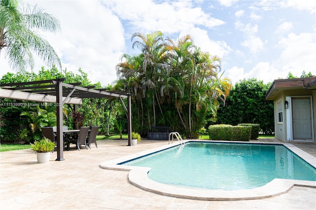 pool with outdoor dining area, a patio, and a pergola