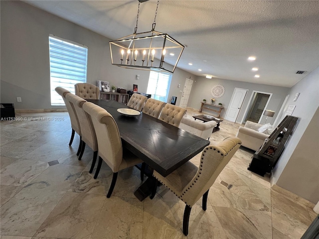 dining area with a textured ceiling, baseboards, visible vents, and recessed lighting