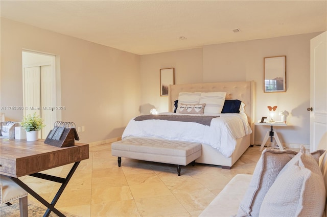 bedroom featuring baseboards