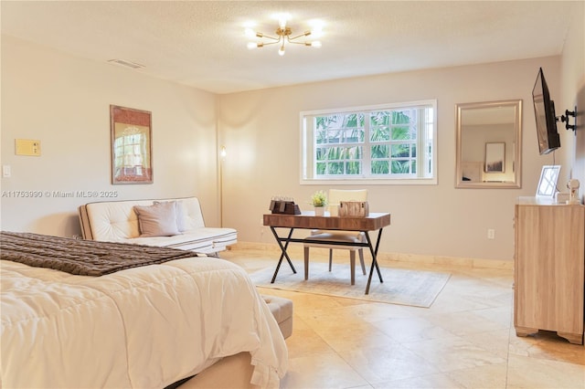 bedroom with a textured ceiling and visible vents