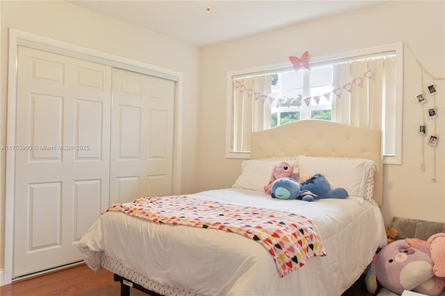 bedroom with a closet and wood finished floors