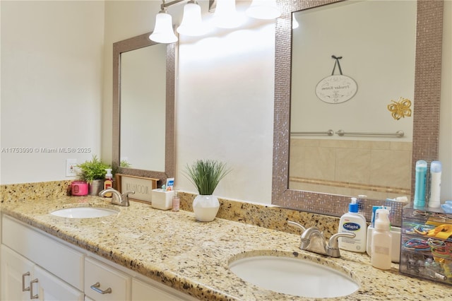 bathroom with double vanity and a sink