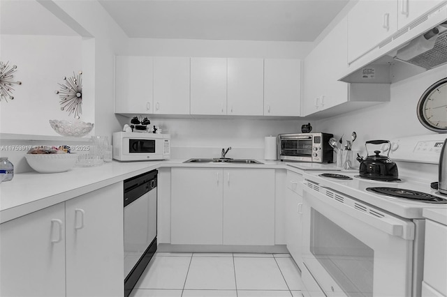 kitchen with light countertops, white appliances, a sink, and under cabinet range hood