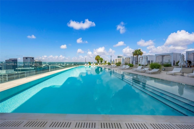 community pool with a patio area