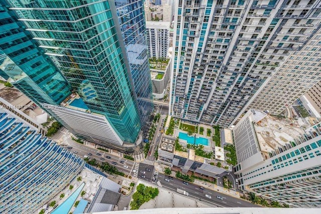 birds eye view of property with a view of city