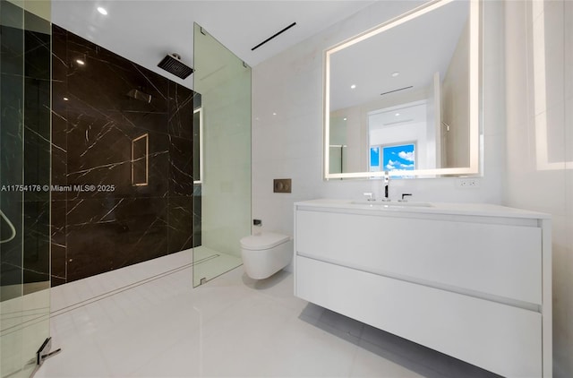 full bathroom with tile walls, a marble finish shower, vanity, and toilet