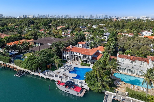 bird's eye view with a view of city and a water view